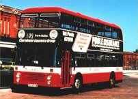 KRU854W with wraparound advertising livery for Charminster Insurance on Wilts & Dorset livery